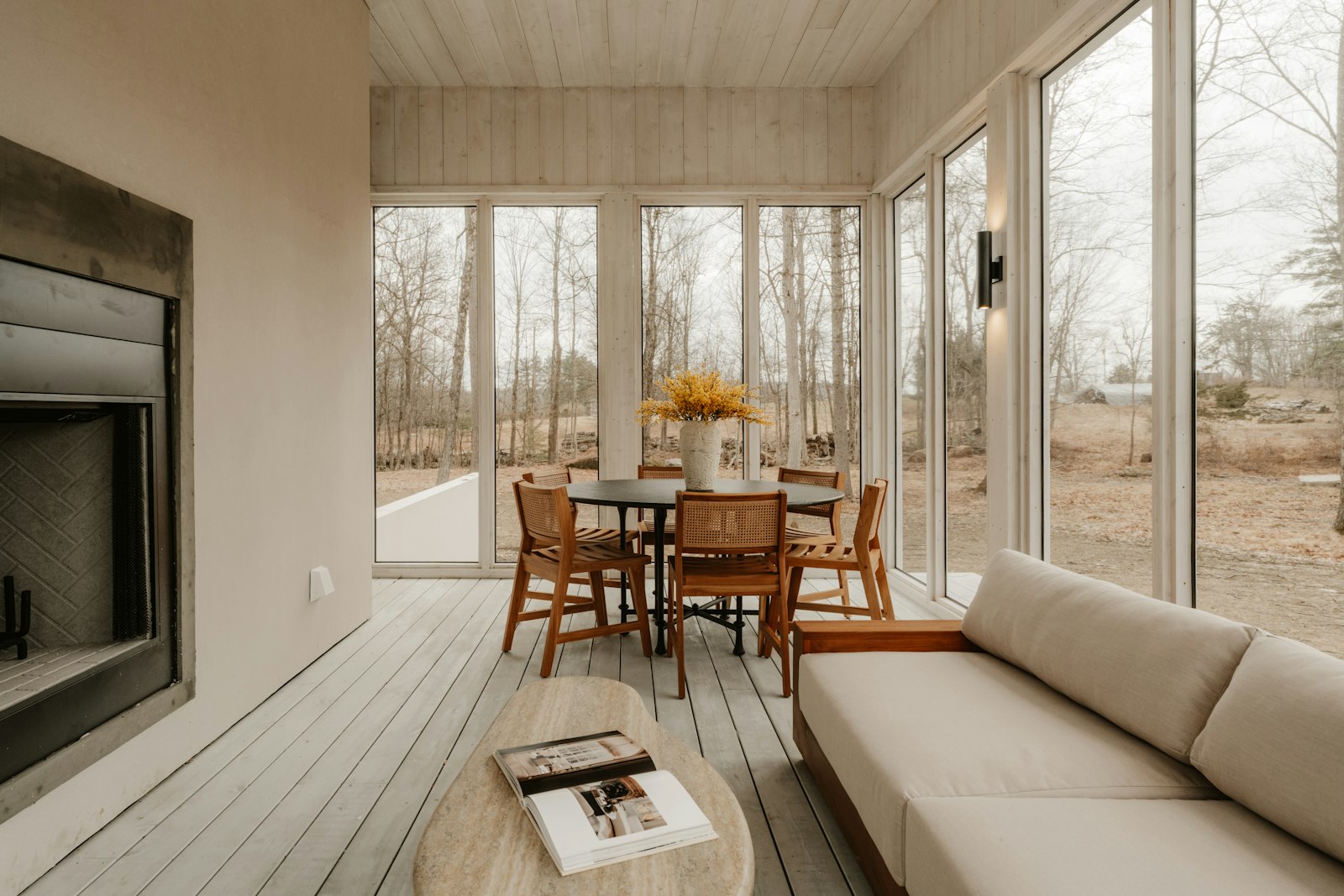 Finished family room addition with floor-to-ceiling windows and a fireplace